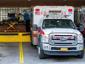 A person is transported from an ambulance to the emergency room at Wyckoff Heights Medical Center on April 7, 2020 in New York, United States. Gov. Andrew M. Cuomo said on Tuesday in his daily briefing that 731 people had died since the prior day of the virus, the states highest one-day total.