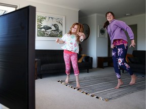 Sisters Nina Goodall and Ivy Goodall follow a Zumba lesson online at their home. Even if a family has self isolated, it shouldnt be visiting other relatives who do the same.