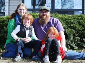 From left, Erin Burns, Garnet Burns-Murphy, Dennis Murphy and Lilith Burns-Murphy.   Erin Burns had her first day of online school with her two kids on Monday.
