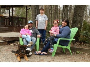 From left: Bella Smith, Adam Smith, Dominic Smith, Rhiannon Smith and Amanda Degrace with their dog Bear.