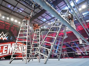 Three-way ladder match between Jimmy Uso, John Morrison and Kofi Kingston.