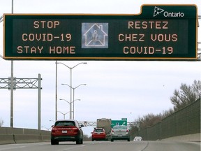 An overhead neon sign - usually used for warning drivers about weather/construction conditions etc. - is now warning drivers to stay home because of COVID-19 along Hwy. 17.