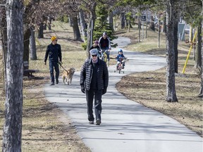 OTTAWA --April 7, 2020.  Pedestrians and cyclists use the path along Byron Avenue on Tuesday morning.