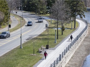 Traffic and pedestrians on the Queen Elizabeth Driveway as the NCC prepares to close part of the roadway to traffic to allow for more physical distancing for pedestrians.
