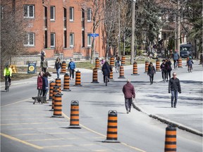 OTTAWA -- April 18, 2020 -- The beautiful spring weather had people out enjoying the Queen Elizabeth Driveway, Saturday April 18, 2020, that was closed to traffic to allow people to have more space to use. ASHLEY FRASER, Postmedia