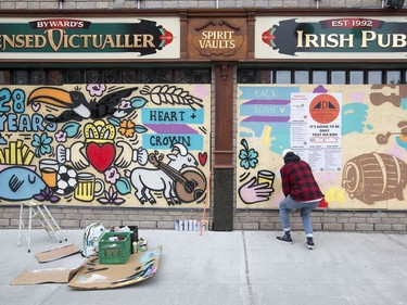 Muralist Robbie Lariviere, who goes by the artist name "Falldown", is working on a number of Byward Market businesses including The Aulde Dubliner and the Heart and Crown (seen here) to help spruce up the ugly boarded up windows and to let customers know that the businesses will be open again whenever the pandemic allows them.