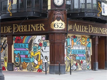 April 24, 2020.  Muralist Robbie Lariviere, who goes by the artist name "Falldown", is working on a number of Byward Market businesses including The Aulde Dubliner (seen here) and the Heart and Crown to help spruce up the ugly boarded up windows and to let customers know that the businesses will be open again whenever the pandemic allows them.