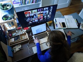 Lauryn Morley, a lower school substitute teacher for the Washington Waldorf School in Bethesda, Maryland, works from her home due to the Coronavirus outbreak, on April 1, 2020 in Arlington, Virginia.