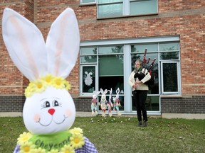 OTTAWA - April 12, 2020 - Erin Shaheen plays the bagpipes in front of The Perley and Rideau Veterans' Hospital on Easter Sunday in Ottawa.