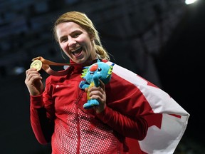 Canada's gold medallist Erica Wiebe poses for photo during the medal ceremony of the women's freestyle 76 kg  wrestling event at the 2018 Gold Coast Commonwealth Games in the Carrara Sports Arena on the Gold Coast on April 12, 2018.
