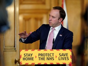 A handout image released by 10 Downing Street, shows Britain's Health Secretary Matt Hancock speaking during a remote press conference to update the nation on the Covid-19 pandemic, inside 10 Downing Street in central London on April 5, 2020. (Photo by Pippa FOWLES / 10 Downing Street / AFP)