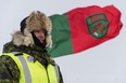 A member from 2nd Canadian Ranger Patrol Group prepares for a visit from Brigadier-General RobRoy MacKenzie and Chief Warrant Officer Kent Clapham during the Schefferville patrol support exercise, Exercise AQIKGIK at Lac Romanet in Québec on February 27, 2017.  

Photo: Corporal Nathan Moulton, Imagery Valcartier
VL02-2017-0020-049