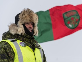 A member from 2nd Canadian Ranger Patrol Group prepares for a visit from Brigadier-General RobRoy MacKenzie and Chief Warrant Officer Kent Clapham during the Schefferville patrol support exercise, Exercise AQIKGIK at Lac Romanet in Québec on February 27, 2017.  

Photo: Corporal Nathan Moulton, Imagery Valcartier
VL02-2017-0020-049