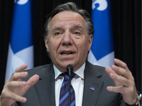 Quebec Premier Francois Legault responds to reporters during a news conference on the COVID-19 pandemic, Monday, April 20, 2020 at the legislature in Quebec City.