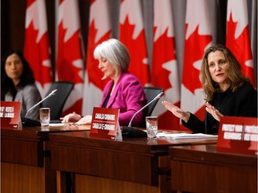 Deputy Prime Minister Chrystia Freeland (right), Minister of Health Patty Hajdu and Chief Public Health Officer Dr. Theresa Tam attend one of what are now daily news conferences on COVID-19.