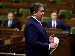 Conservative Party leader Andrew Scheer speaks in the House of Commons as legislators convene to give the government power to inject billions of dollars into the economy to help individuals and businesses, on March 25.