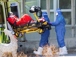 Ambulance attendants transport a resident from Centre d'hebergement de Sainte-Dorothe, a seniors' long-term care centre, amid the outbreak of the coronavirus disease (COVID-19), in Laval, Quebec, Canada April 16, 2020.