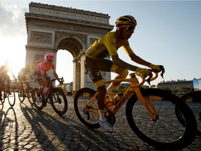 Team INEOS rider Egan Bernal of Colombia, wearing the overall leader's yellow jersey, in action in front of the Arc de Triomphe during the final stage of last year's Tour de France.