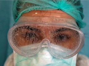 Nurse Dilara Fahrioglu's goggles are covered with vapor after taking care of a patient suffering from the coronavirus disease (COVID-19)  at an intensive care unit of the Medicana International Hospital in Istanbul, Turkey, April 14, 2020. Picture taken April 14, 2020.