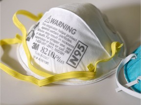 FILE PHOTO: Various N95 respiration masks at a laboratory of 3M, that has been contracted by the U.S. government to produce extra marks in response to the country's novel coronavirus outbreak, in Maplewood, Minnesota, U.S. March 4, 2020.