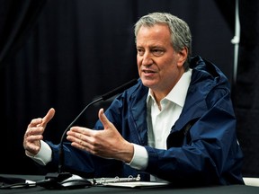 New York City Mayor Bill De Blasio speaks to the media during a press conference in temporary hospital as COVID-19 continues in the Queens borough of New York City, New York, U.S., April 10, 2020.