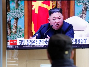 South Korean people watch a TV broadcasting a news report on North Korean leader Kim Jong-un in Seoul, South Korea, April 21, 2020. Where has Kim been?
