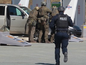 RCMP officers in Enfield, N.S. on Sunday April 19, 2020.