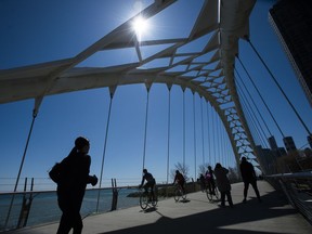 People get exercise outside on the lake shore path along Lake Ontario in Toronto on Thursday, April 2, 2020. Health officials and the government has asks that people stay inside to help curb the spread of the coronavirus also known as COVID-19.