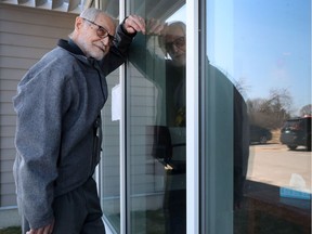 OTTAWA - April 28, 2020 - Matthew Surkan looks in the window for his wife Viola at Peter D Clark in Ottawa Tuesday. This is the first day since the decision to stop bringing residence to the windows. Matthew has been going to see his wife everyday through the window. The couple have been married for 68 years.