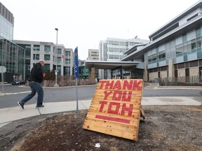 People have placed thank you signs for the workers outside the Ottawa Hospital General Campus in Ottawa Tuesday March 31, 2020.