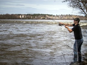 Roberto Rodrigues spent some time in the sunshine giving fishing a go in the Ottawa River at Bate Island on Saturday, April 4, 2020.