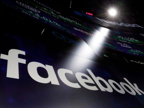 In this March 29, 2018, file photo, the logo for Facebook appears on screens at the Nasdaq MarketSite in New York's Times Square. Facebook wants a judge to toss out the federal privacy watchdog's finding that the social-media giant's lax practices allowed personal data to be used for political purposes.THE CANADIAN PRESS/AP/Richard Drew, File