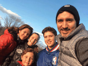 A photo posted by Sophie Grégoire Trudeau of herself and Justin Trudeau with their three children at their cottage.