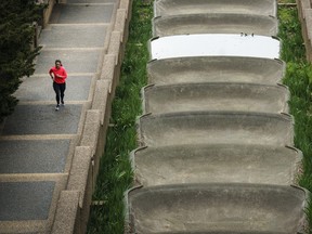 A woman jogs through a mostly empty Meridian Hill Park on April 1, 2020 in Washington, DC.