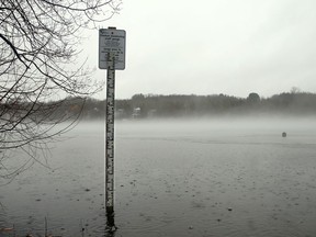 A water-measuring stick sits submerged in the Ottawa River in April, as officials watched for signs of a repeat of last year's devastating floods.