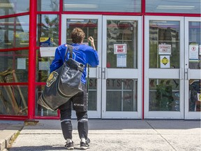 OTTAWA --May 21, 2020.  Not so fast, the arena has been closed again: A hockey player waits for the doors to open as hockey players take advantage of ice time  at the Minto Arena.