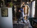 Joe Thottungal, the award-winning chef and owner of Coconut Lagoon, shows the damage after a fire broke out Friday night at the popular restaurant.