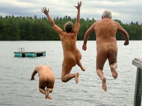 Julie Oliver of the Ottawa Citizen won a national award for this photo of three campers at a nudist park braving chilly temperatures to take a dip.