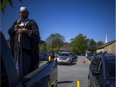 OTTAWA -- May 23, 2020 -- Imam Muhammad Sulaiman lead a special drive-in Eid prayer that was held at the Ottawa Mosque on Northwestern Ave, Saturday, May 23, 2020.