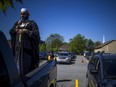 Imam Muhammad Sulaiman leads a special drive-in Eid prayer at the Ottawa Mosque on Saturday.