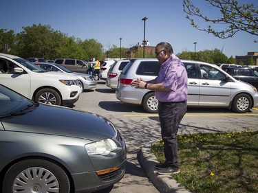 OTTAWA -- May 23, 2020 -- Ahmed Ibrahim, president of the Ottawa Muslim Association helped cars park, socially distanced apart, for the special drive-in Eid prayer that was held at the Ottawa Mosque on Northwestern Ave, Saturday, May 23, 2020.