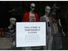 A sign at the window of a closed J.Crew store near Rockefeller Plaza in New York City.