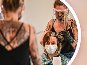 FILE: A woman visits the a hair salon.