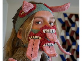 Fashion designer Yr Johannsdottir poses for a photo wearing one of her masks at her studio in Reykjavik, Iceland on May 11, 2020.
