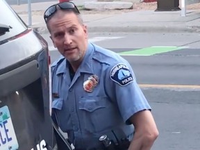 Still image taken on May 25, 2020, from a video courtesy of Darnella Frazier via Facebook, shows Minneapolis police officer Derek Chauvin during the arrest of George Floyd. - Chauvin has been arrested on May 29, 2020, days after Floyds fatal arrest that sparked protests, rioting and outcry across the city and nation.