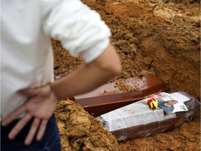 A man is seen during a mass burial of people who have passed away due to the coronavirus disease (COVID-19), at the Parque Taruma cemetery in Manaus, Brazil, May 6, 2020.