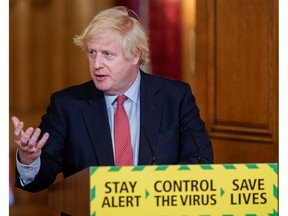 Britain's Prime Minister Boris Johnson holds a daily news conference.