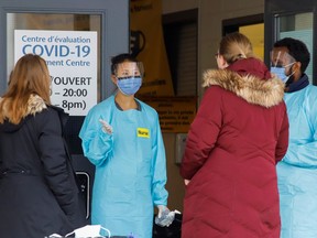 A nurse greets patients outside a coronavirus disease (COVID-19) assessment center in Ottawa, Ontario, Canada March 25, 2020.