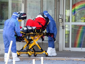 Paramedics transport a resident from Centre d'hebergement de Sainte-Dorothe, a seniors' long-term care centre, amid the outbreak of the coronavirus disease (COVID-19), in Laval, Quebec.