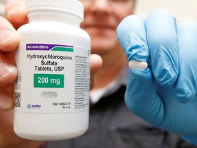 FILE PHOTO: The drug hydroxychloroquine, pushed by U.S. President Donald Trump and others in recent months as a possible treatment to people infected with the coronavirus disease (COVID-19), is displayed by a pharmacist at the Rock Canyon Pharmacy in Provo, Utah, U.S., May 27, 2020.